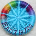 Rainbow and sky blue Dorset button with beaker Button written around the rim